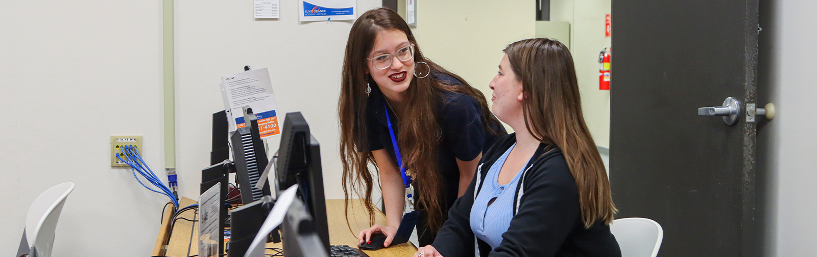 SUNY Orange student being advised at computer